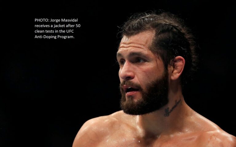 Photo: Jorge Masvidal receives a blazer from the UFC Anti-Doping Program after passing 50 clean tests.
